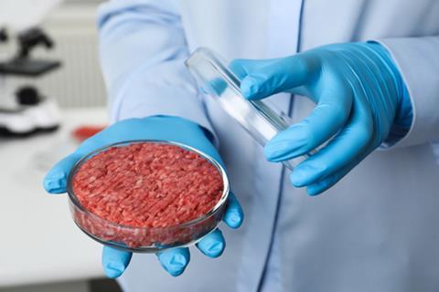 Scientist,Holding,Petri,Dish,With,Minced,Cultured,Meat,In,Laboratory,