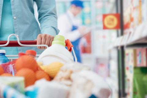 Woman,Pushing,A,Shopping,Cart,And,Doing,Grocery,Shopping,At