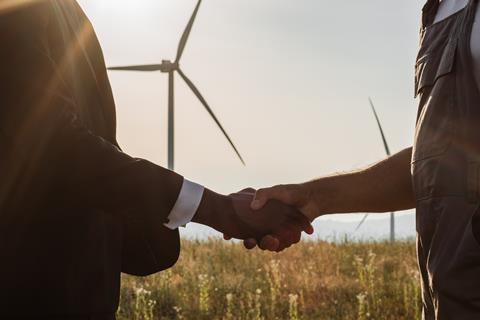 Close,Up,Of,Indian,Technician,And,African,American,Inspector,Shaking