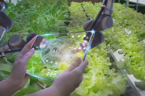 Farmers,Use,Futuristic,Tablet,To,Inspect,Robotic,Arm,Harvest,Produce