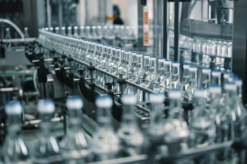 Closed,Glass,Bottles,Of,Upscale,Vodka,Transported,By,Line