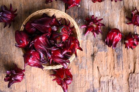 Hibiscus,Sabdariffa,Or,Roselle,Fruits,On,Wooden,Background