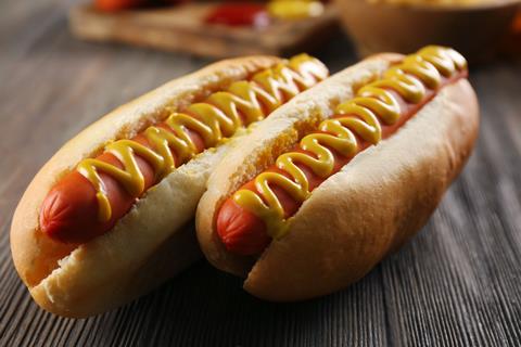 Hot,Dogs,On,Wooden,Background,Closeup